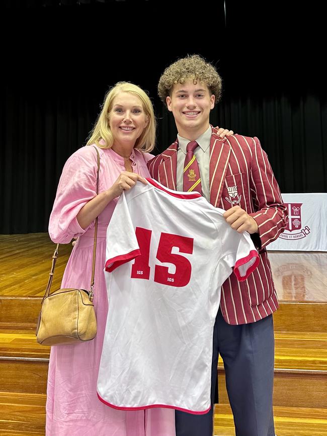 Kylie and son Tyson with his IGS First XV jumper.