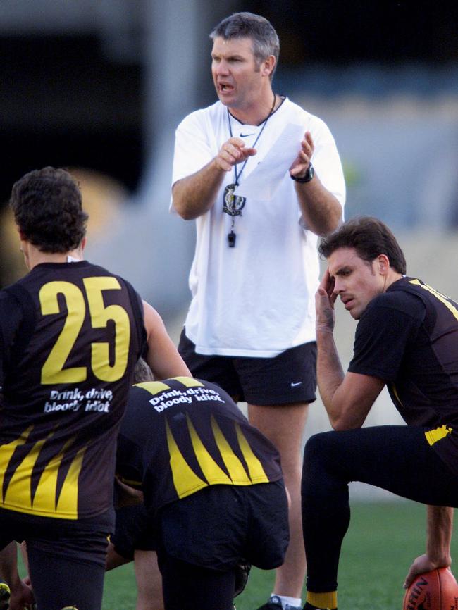 Matthew Richardson and Brendon Gale listen to Frawley during his coaching career.