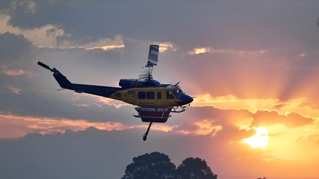 A McDermott Group Bell 214B involved in water bombing the Obi Obi Valley bushfire, Witta. Picture: Patrick Woods.