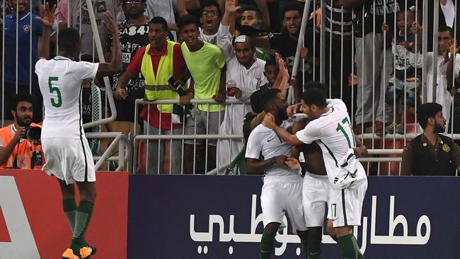 Fahad Al Muwallad (2nd R) of Saudi Arabia celebrates.