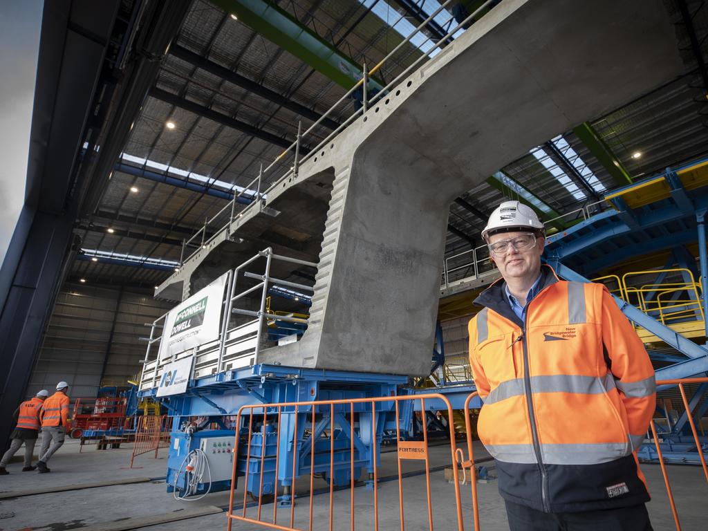 McConnell Dowell interface manager Gary Baird with the first segment manufactured at the new Bridgewater Bridge concrete facility at Bridgewater. Picture: Chris Kidd