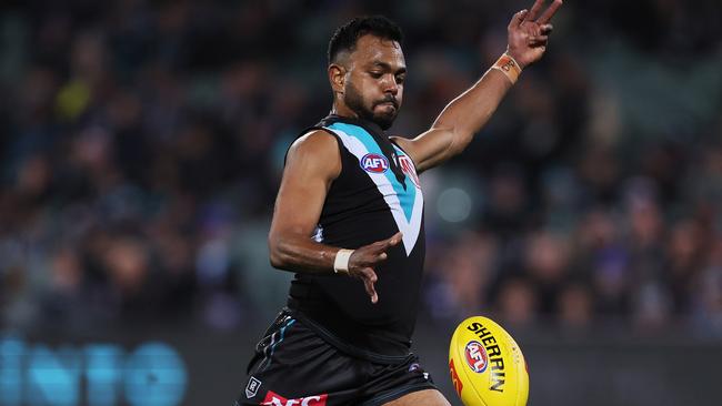 ADELAIDE, AUSTRALIA - JULY 08: Junior Rioli of the Power kicks a goal during the 2023 AFL Round 17 match between the Port Adelaide Power and the Gold Coast Suns at Adelaide Oval on July 8, 2023 in Adelaide, Australia. (Photo by James Elsby/AFL Photos via Getty Images)