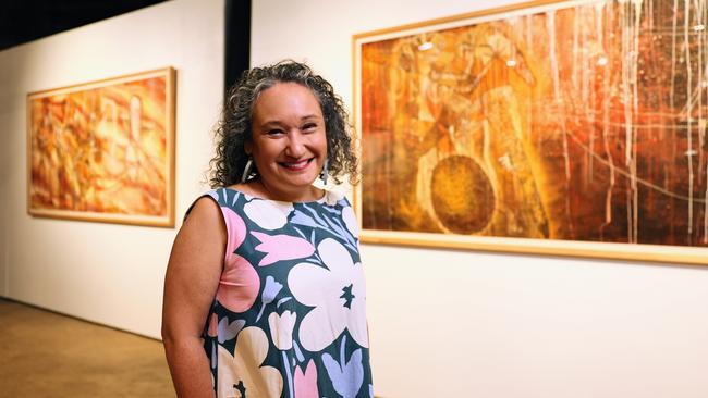 The Cairns Indigenous Art Fair will commence its 2024 program, with the satellite exhibition Not Selling Cakes: Celebrating CIAF's 15th Anniversary opening on Friday. CIAF Artistic Director Francoise Lane oversees the installation of the exhibition at the Tanks Arts Centre. Picture: Brendan Radke