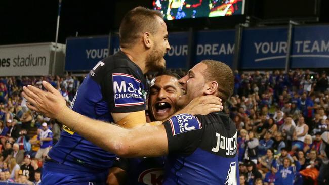 Bulldog Marcelo Montya celebrates scoring a try with Josh Reynolds and Brenko Lee.