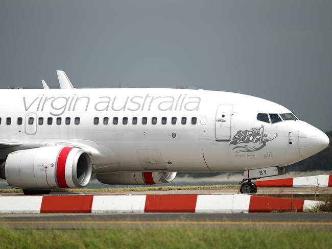 Virgin Australia will be reviewing all domestic flight routes following a seventh consecutive annual deficit. (Photo by Cameron Spencer/Getty Images)