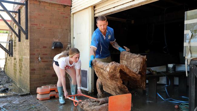 Mel Steer and Blake Lepagier begin the clean up at their Windsor house. Picture: Tim Hunter