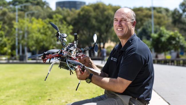 Professor and head of the civil engineering department at Monash University Jeff Walker, with a drone which his department has engineered to measure water levels on the ground. Picture: Dannika Bonser