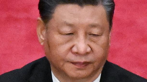 China's President Xi Jinping applauds during the opening session of the National People's Congress (NPC) at the Great Hall of the People in Beijing on March 5, 2023. (Photo by NOEL CELIS / AFP)