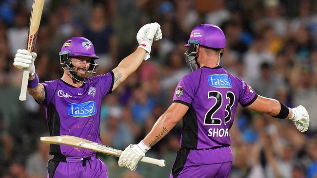 Matthew Wade of the Hobart Hurricanes and D'Arcy Short of the Hobart Hurricanes celebrate after defeating the Strikers during the Big Bash League match between the Adelaide Strikers and the Hobart Hurricanes at Adelaide Oval. Picture: DANIEL KALISZ