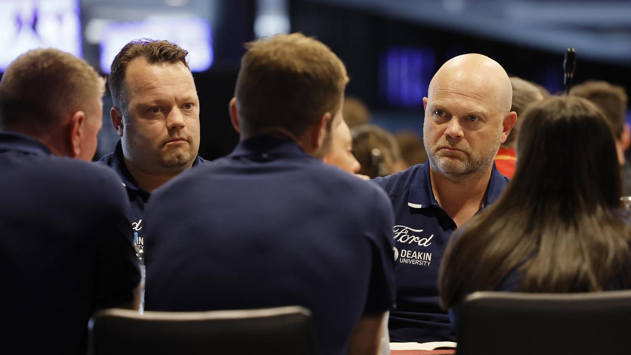 Geelong coach Dan Lowther (right) and the brains trust at the AFLW draft on Monday night. Picture: Dylan Burns/AFL Photos via Getty Images