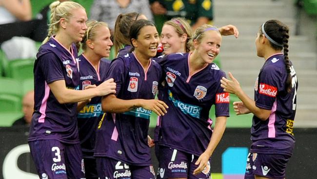 Sam Kerr congratulated by Perth Glory teammates after scoring a goal.