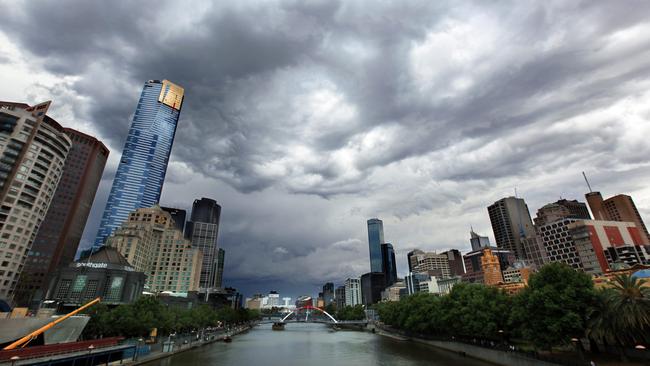 A storm brews over the Melbourne skyline. Clouds.