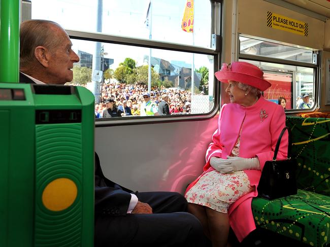 Queen Elizabeth II and the Duke of Edinburgh ride on a tram through Melbourne’s CBD in 2011, past huge crowds of well-wishers. Picture: PA Images via Getty Images