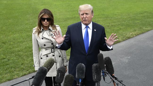 US President Donald Trump talks to the press flanked by First Lady Melania Trump in 2017. (Photo by Brendan Smialowski / AFP)