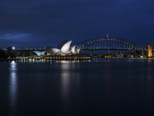 Sydney Opera House and Harbour Bridge skyline at dusk in the Sydney Botanic Gardens. Picture: Darren Leigh Roberts