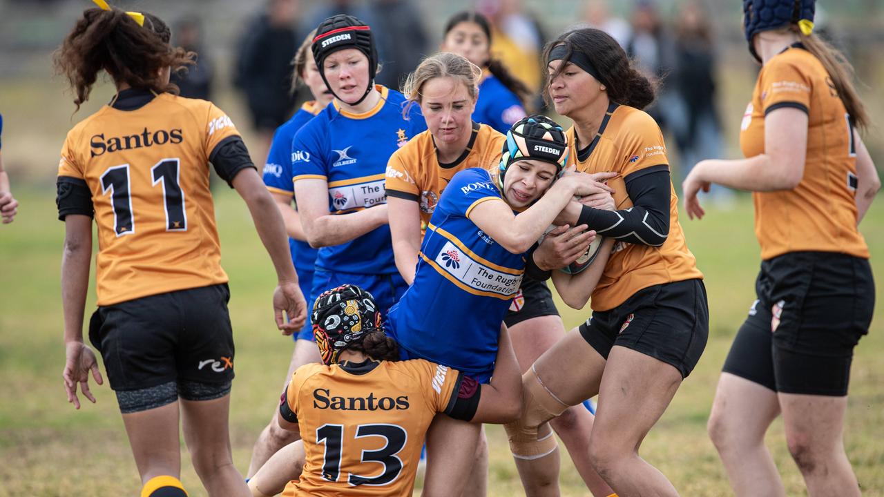 Sydney’s Georgia Wansey is tackled in the under 14s game. Pictures: Julian Andrews