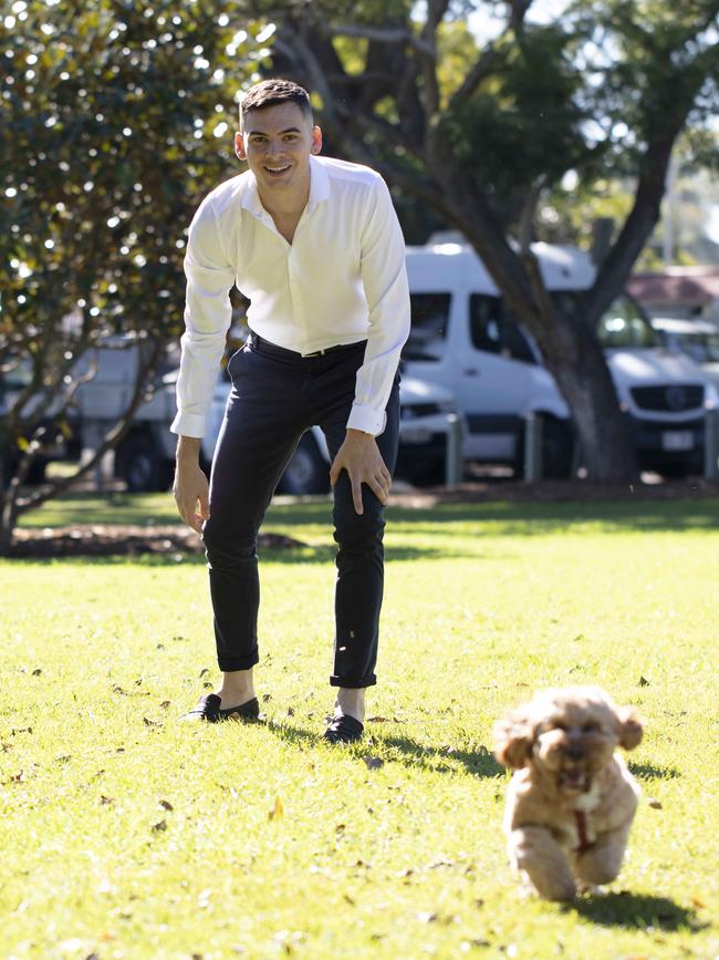 Josh Fritz, pictured with Quincy, is the founder of a new app that links dog owners up for play dates. Picture: Russell Shakespeare