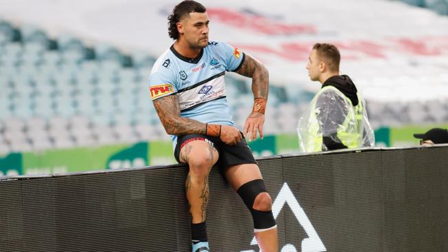 Cronulla's Andrew Fifita takes a break on the sidelines this week.