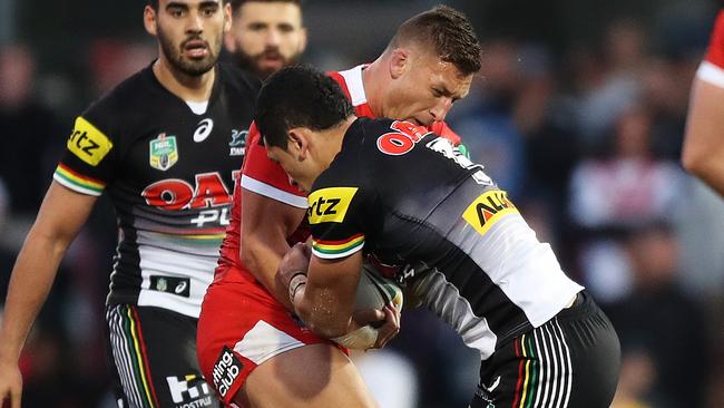 Tariq Sims steals the ball from Penrith's Dallin Watene-Zelezniak to score a try for the Dragons. Picture: Brett Costello