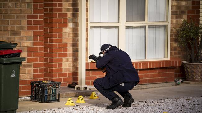 Police at the scene of a stabbing on Sunburt Street, Ingle Farm. Picture: Mike Burton