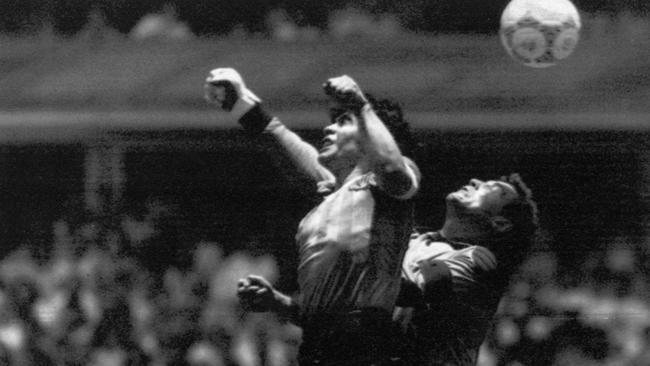 Diego Maradona leaping for the ball in the 1986 World Cup. He scored with his hand – the famous ‘Hand of God’ goal.