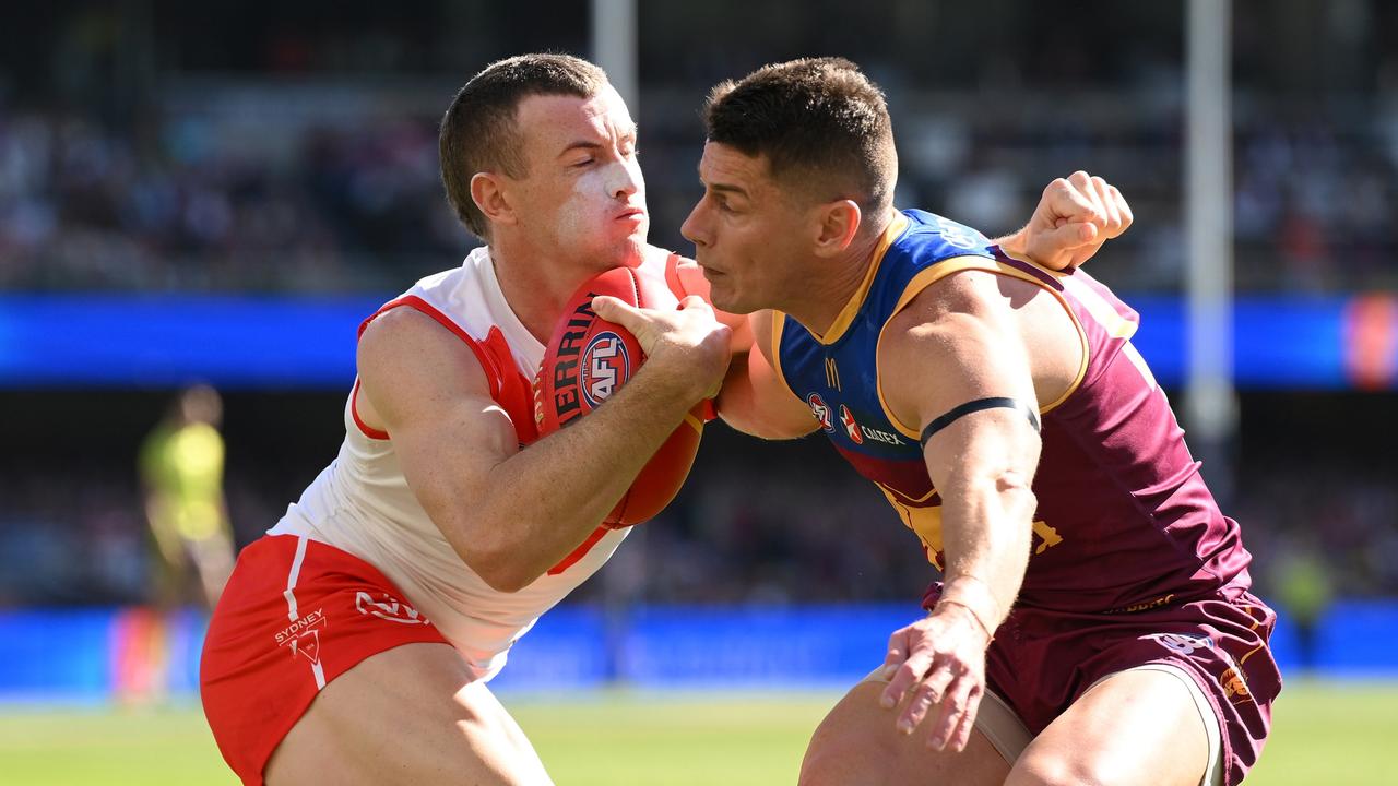 Lions star Dayne Zorko (right) battles with Sydney’s Chad Warner during Brisbane’s two-point win over the Swans. Picture: Matt Roberts/AFL Photos/via Getty Images