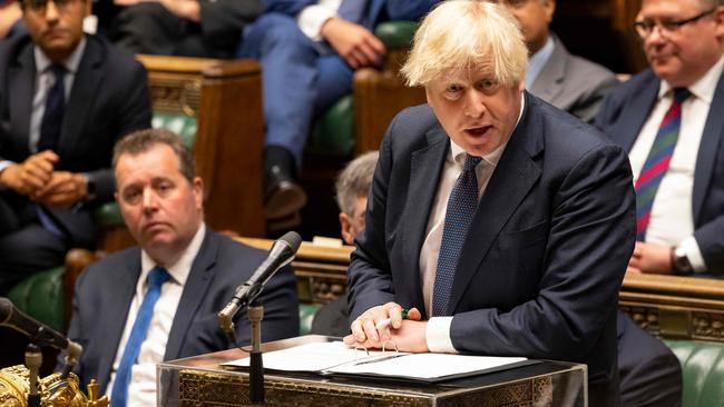 Boris Johnson has urged Scott Morrison to step up on carbon emissions and over resettlement of Afghan refugees. Picture: AFP.