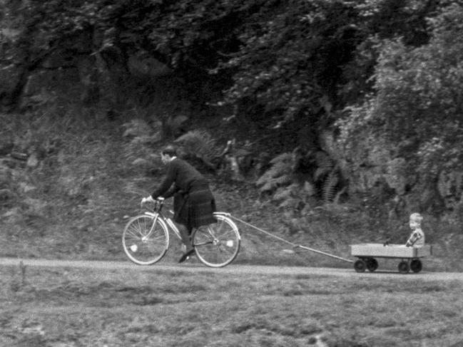 Prince Charles tows Prince Harry in a home made cart, near Balmoral Castle, during their summer break, on September 5, 1988 in Balmoral, Scotland. Picture: Getty Images