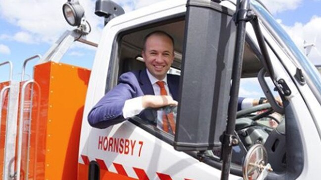 Matt Kean poses in a Hornsby RFS truck. Scott Morrison has slapped down his claims the PM’s frontbenchers want more action on climate change. Picture; Facebook.