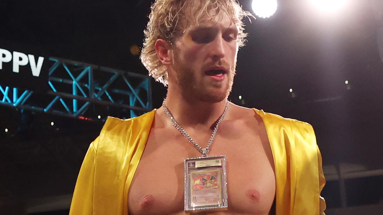 Logan Paul wears a Charizard Pokemon card chain as he enters the ring against Floyd Mayweather. Photo by Cliff Hawkins/Getty Images.