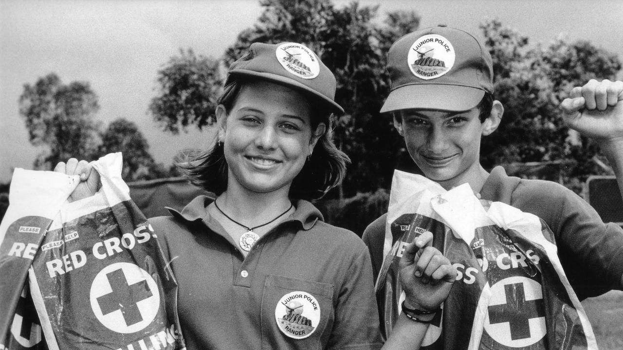 Junior Police Rangers Aimee Fuller Grae Saunders, 13, prepare to knock on doors to raise funds for the Red Cross in 1997.