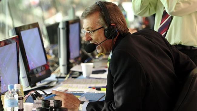 TV presenter sports commentator Dennis Cometti broadcasting during Collingwood vs Fremantle Dockers football match at MCG 23 May 2004.