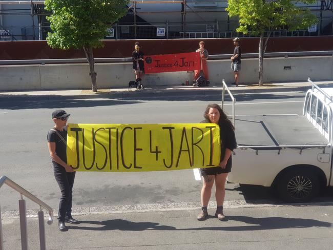 Loved ones of Jari Wise, who died at Huonville in 2020 with "Justice 4 Jari" banners. Picture: Amber Wilson