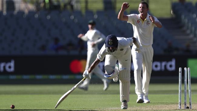 Cheteshwar Pujara is run out by a direct hit. Picture: AP