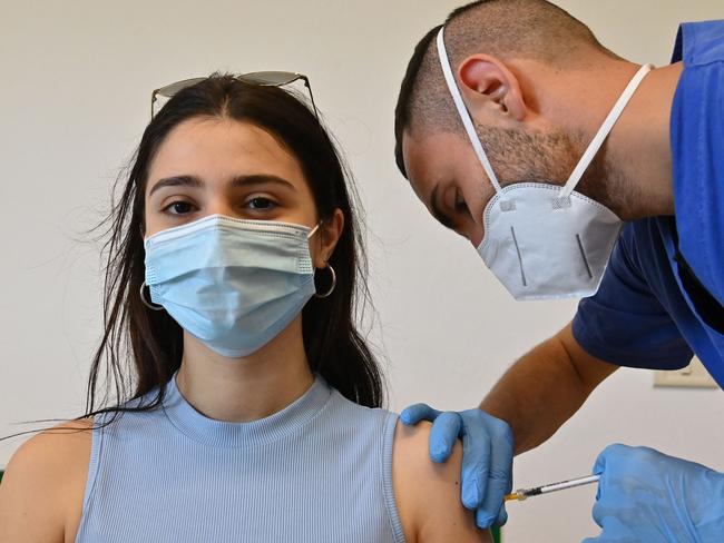 A woman receives the Pfizer vaccine at a health centre on the southern Italian island of Lampedusa. Picture: AFP