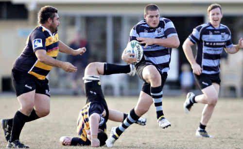 Maroochydore’s James Turvey runs the ball over the Caloundra defence. Picture: Cade Mooney