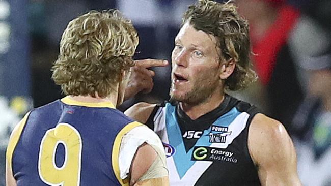 You got me there! Brad Ebert shows Rory Sloane where he was hit in a marking contest. Picture: Sarah Reed