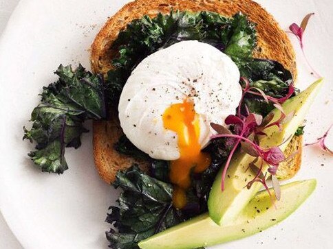 Poached egg with wilted kale and avocado.