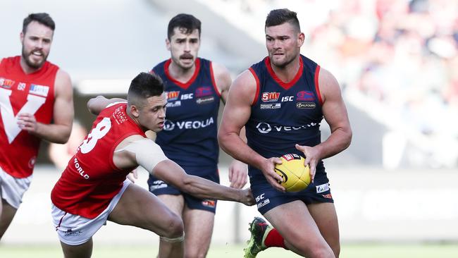 Grigg breaks away from Robbie Young during the grand final. Picture: Sarah Reed