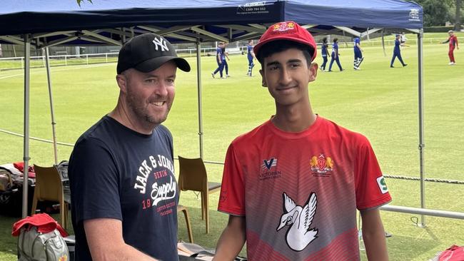 Akshay Ramkumar receives his First XI cap from former Swans paceman Matthew Hawking.