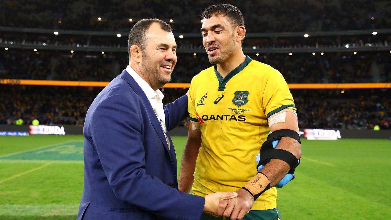 Rory Arnold and Wallabies coach Michael Cheika embrace at Optus Stadium.