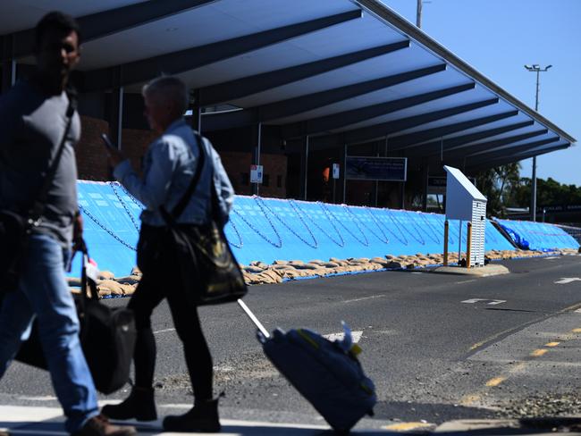 Flood barriers are placed around the passenger terminal at Rockhampton airport. Picture: AAP Image/Dan Peled