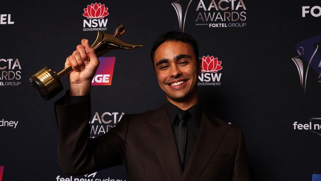 SYDNEY, AUSTRALIA - DECEMBER 07: Thomas Weatherall poses in the media room with AACTA Award for Best Supporting Actor in Drama for his role as Malakai in Heartbreak High. (Photo by Caroline McCredie/Getty Images for AFI)