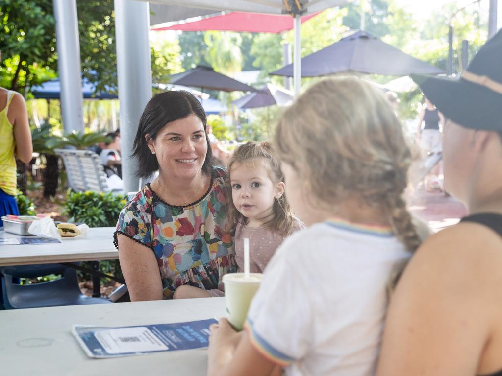 Newly appointed Chief Minister Natasha Fyles with little Nightcliff local Heidi, spinning Sunday yarns with market goers as per usual. Picture: Floss Adams.