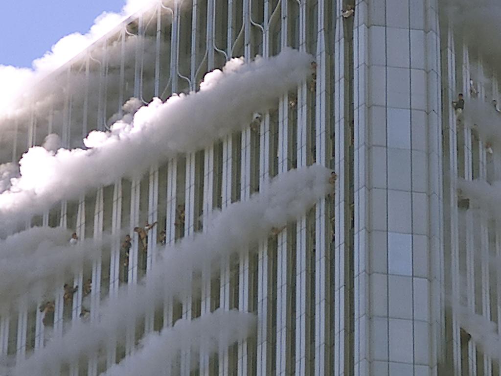 People hang from the windows of the North Tower of the World Trade Centre after a hijacked airliner hit the building on September 11, 2001 in New York City. Picture: Jose Jimenez/Primera Hora/Getty Images