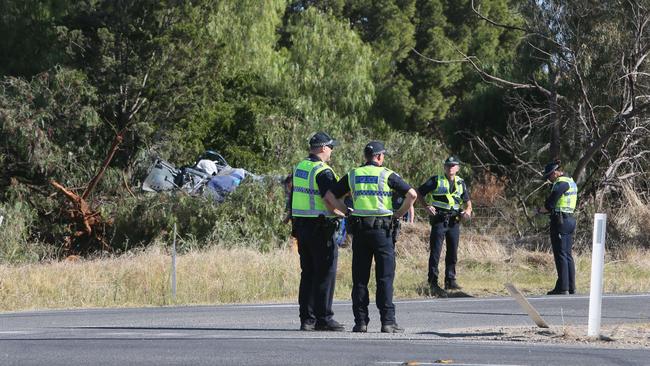 Major Crash Investigators, Police and Emergency service crews at the scene of the crash on the corner of Wingate Road, Angle Vale Road and Dalkeith Road, Hillier. Picture: Emma Brasier