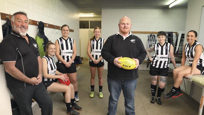 Norwood great and Payneham Norwood Union men’s coach Garry McIntosh (left) with women’s coach Ben Hunt and players from (left to right) Ella Murison, Nichola Venter, Jemma Valente, Emma Cornish, and Sophia Mazzaferro. Picture Dean Martin