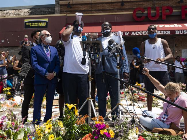 Floral tributes at the site where George Ffloyd was arrested. Picture: AFP/Getty Images