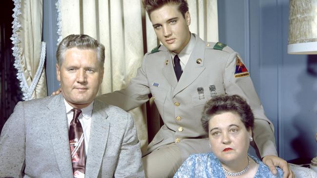 A rare 1958 photograph of Elvis with his parents Vernon and Gladys. Picture: EPE Graceland