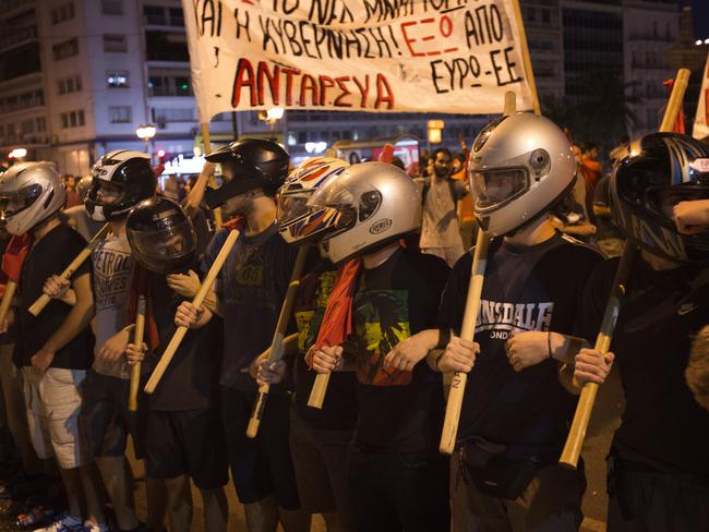 Anti-austerity protesters march in front of the parliame<b>nt.</b>